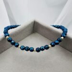 Bratara cu hematit albastru fatetat si 5 bilute din aur 14k