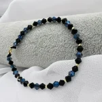 Bratara cu 10 bilute + inchizatoare si anou din aur 14k