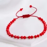 Bratara cu cristale biconice si 5 bilute din aur 14k