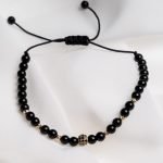 Bratara Black onix cu charm cu pietricele negre și bilute din aur 14k