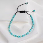 Bratara cu howlit turcoaz si 10 bilute din aur 14k