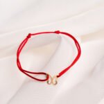 Bratara cu snur si fluturas din aur 14k