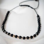 Bratara cu onix fatetat si 13 bilute din aur 14k