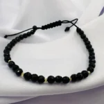 Bratara cu onix fatetat si 5 bilute din aur 14k