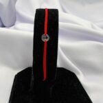 Bratara cu snur si disc cruciulita din argint 925